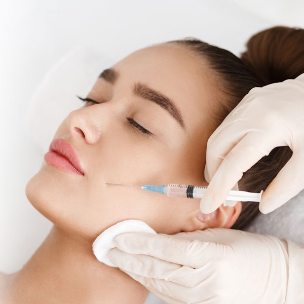 Woman receiving BOTOX® Cosmetic Injections