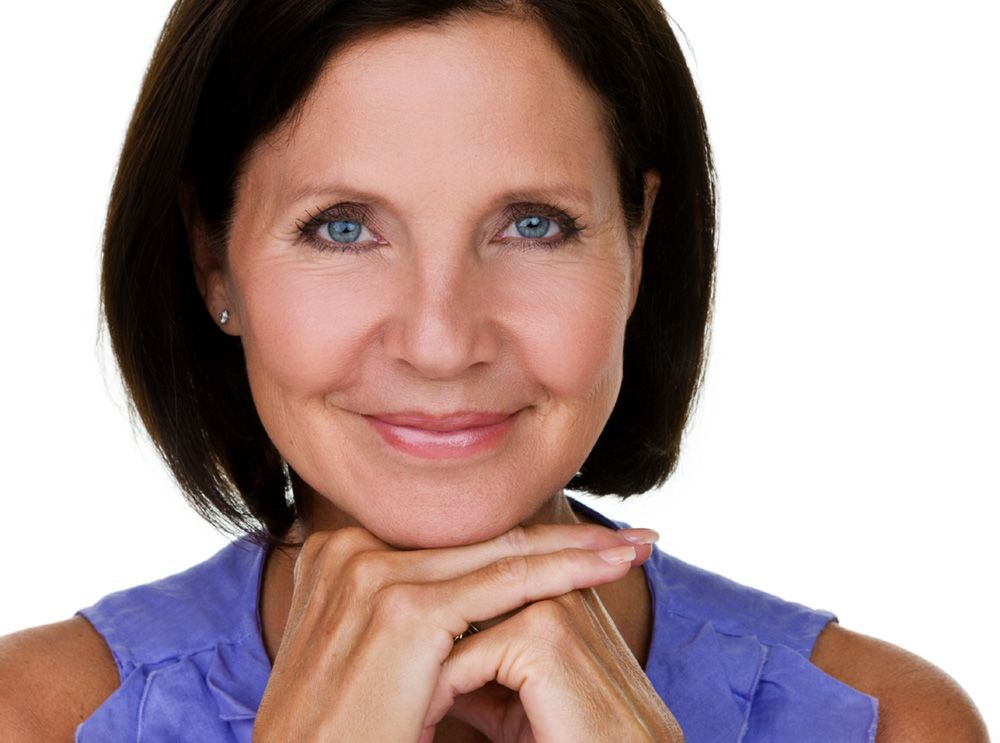Woman with beginning signs of aging around the eyes