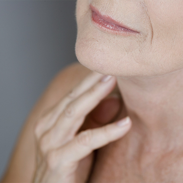 Patient with fingers resting against neck